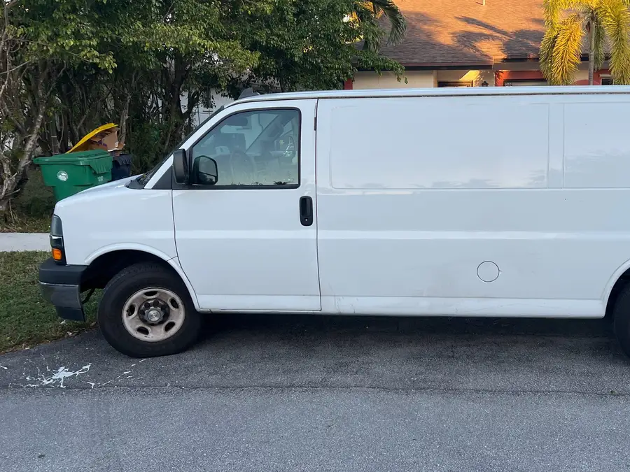 White service van parked in a driveway, ready to head to the next job