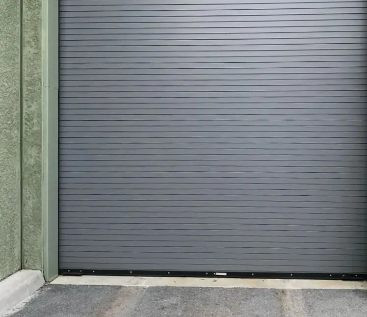 Gray roll-up door on a commercial building