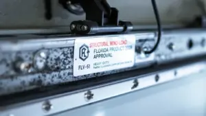Florida Product Approval label on structural wind-load heavy duty door system.